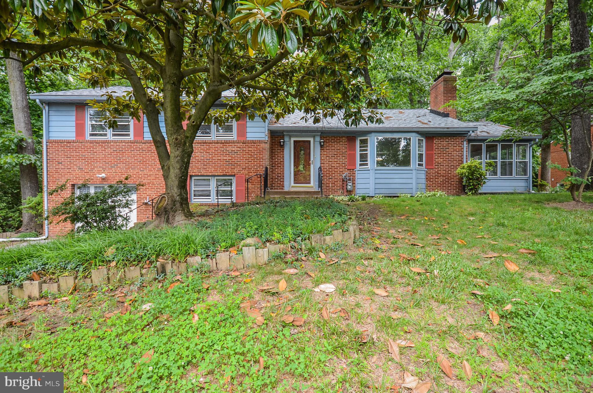 10751 Kinloch Road Silver Spring, MD 20903 - Photo 1 of 30 a front view of a house with garden