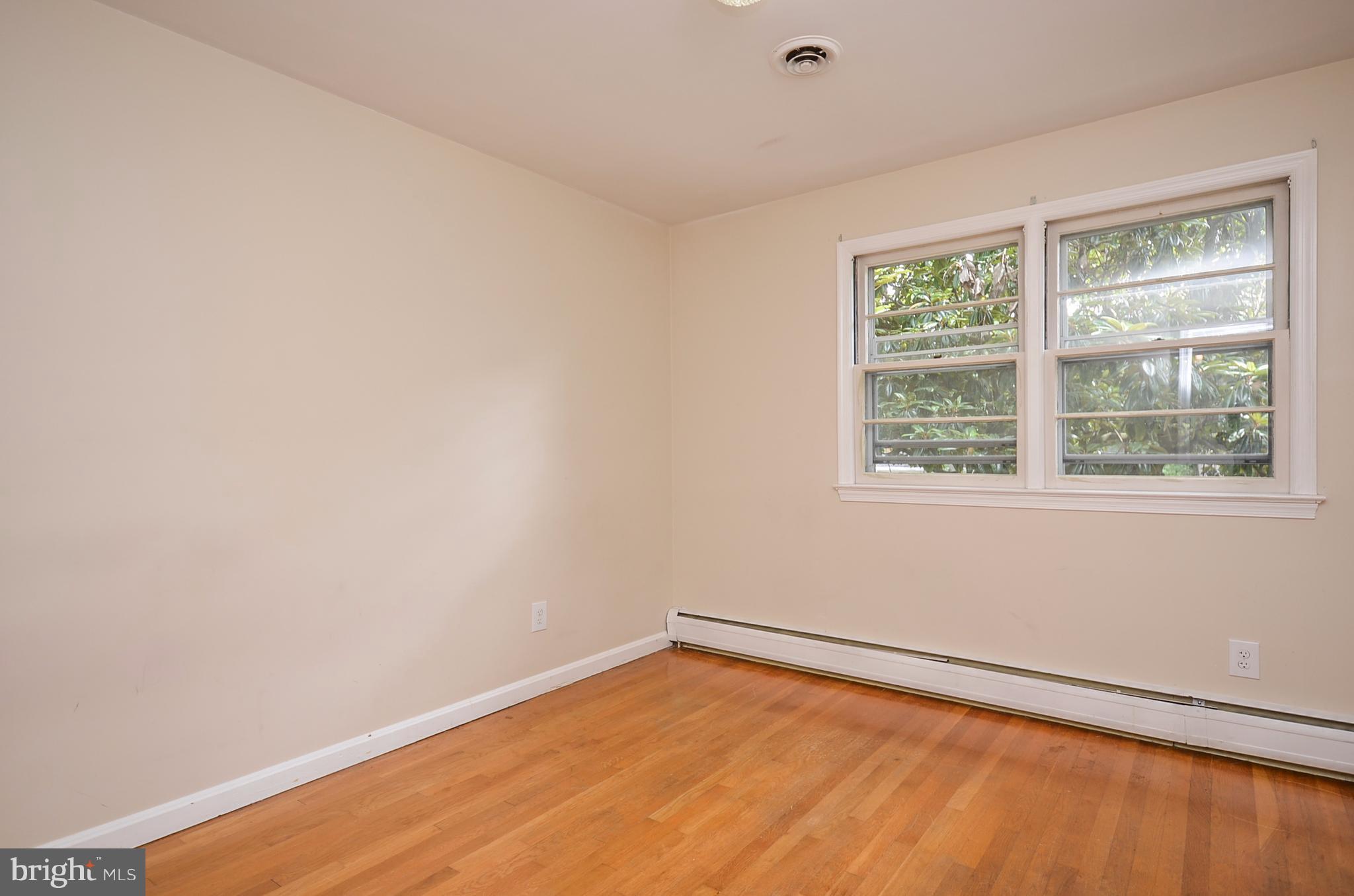 10751 Kinloch Road Silver Spring, MD 20903 - Photo 13 of 30 a view of an empty room with a window