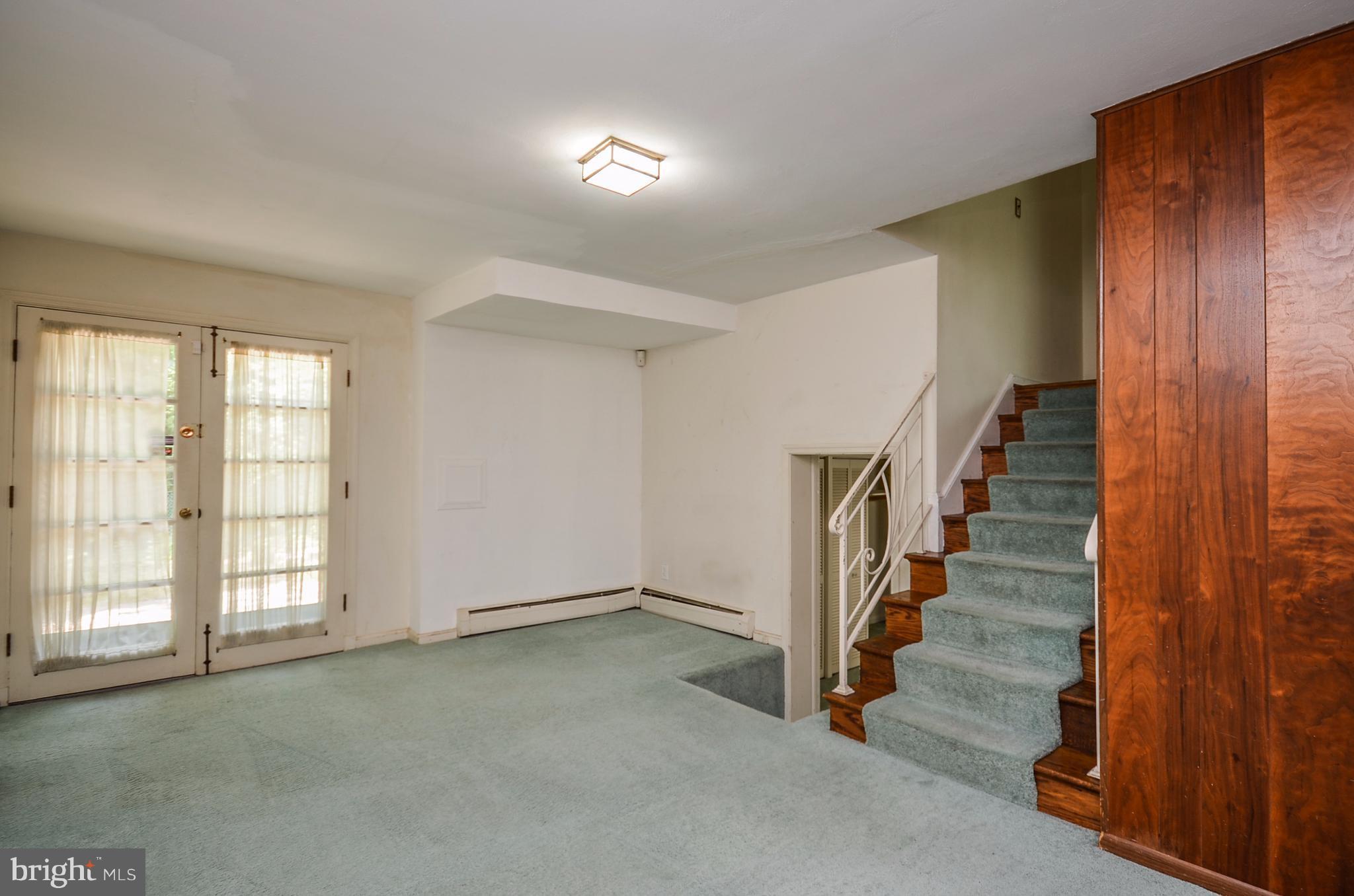 10751 Kinloch Road Silver Spring, MD 20903 - Photo 17 of 30 a view of an empty room with stairs