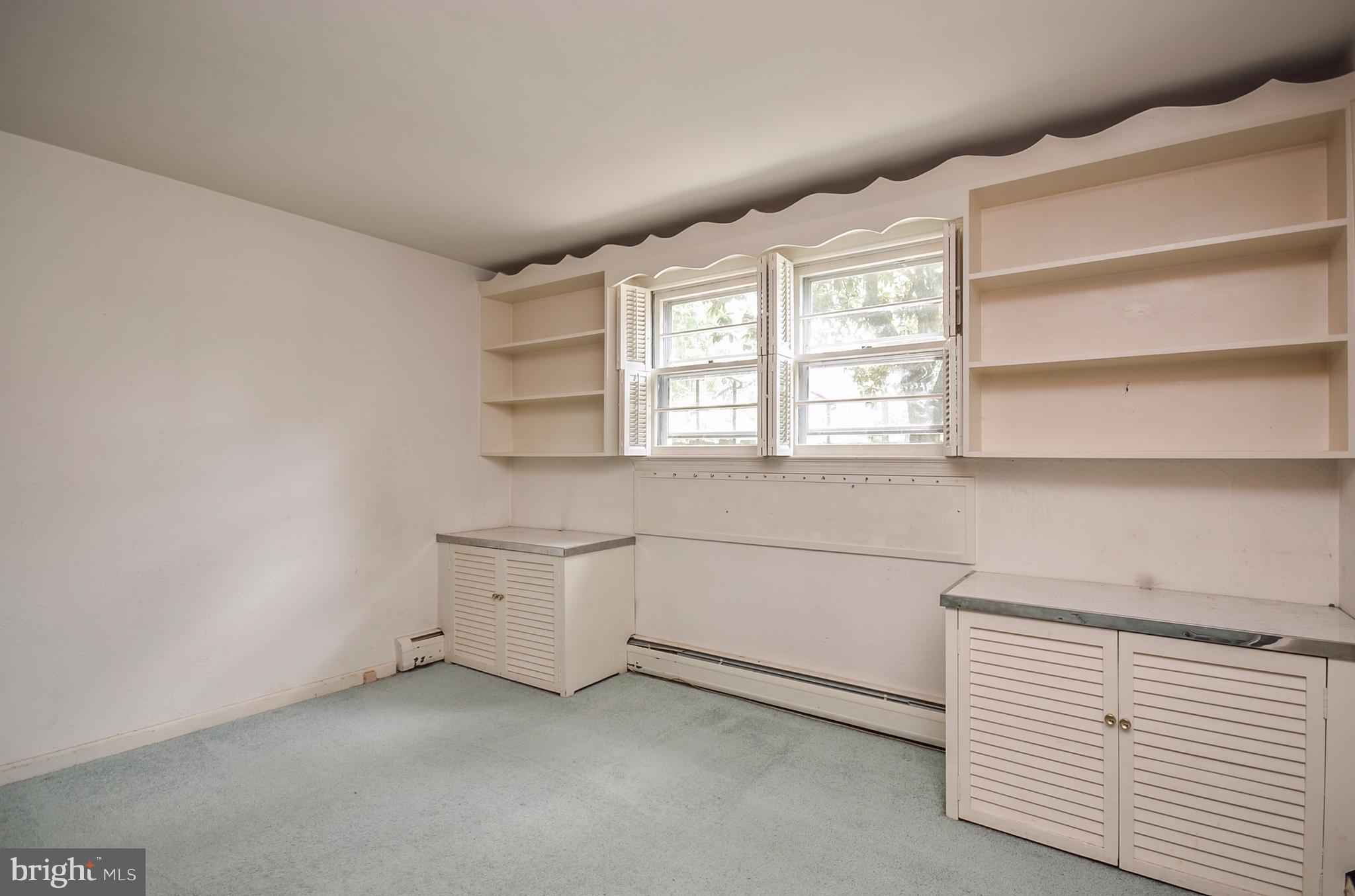 10751 Kinloch Road Silver Spring, MD 20903 - Photo 18 of 30 a view of an empty room with a window