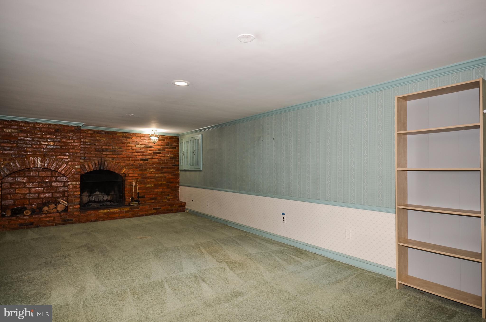 10751 Kinloch Road Silver Spring, MD 20903 - Photo 22 of 30 a view of an empty room with a fireplace