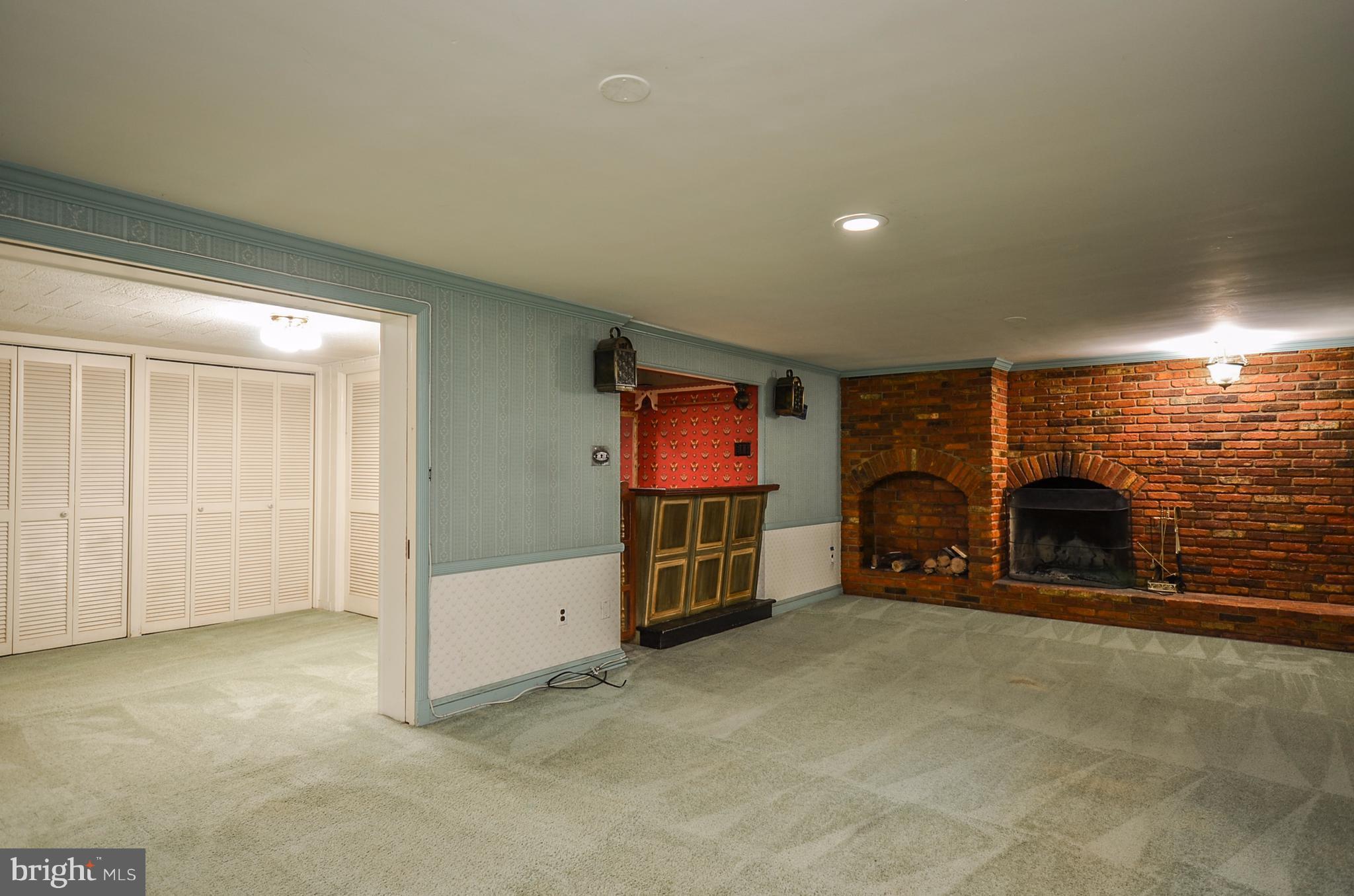 10751 Kinloch Road Silver Spring, MD 20903 - Photo 23 of 30 a view of an empty room and fire place