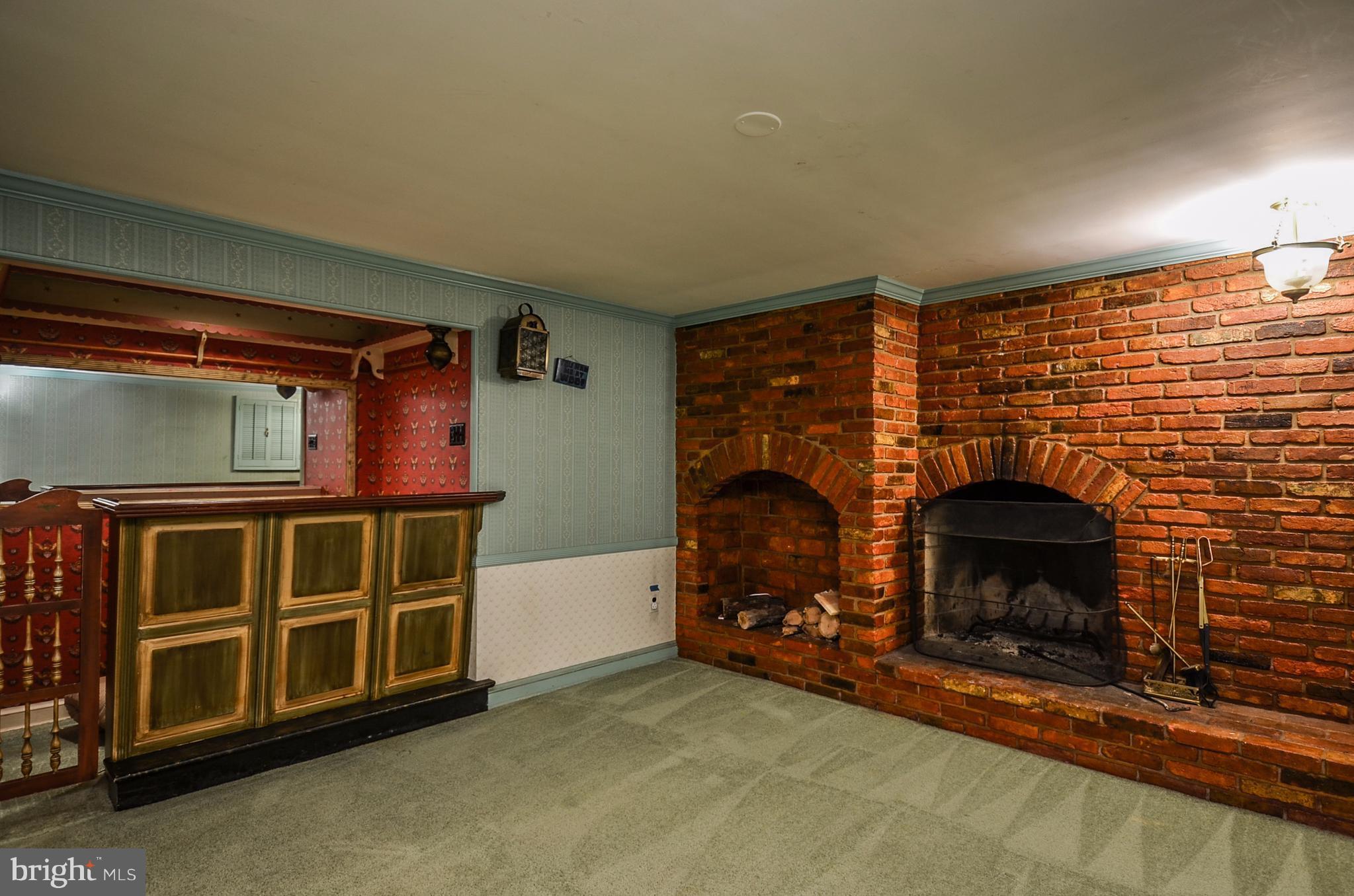 10751 Kinloch Road Silver Spring, MD 20903 - Photo 24 of 30 a living room with furniture and a fireplace