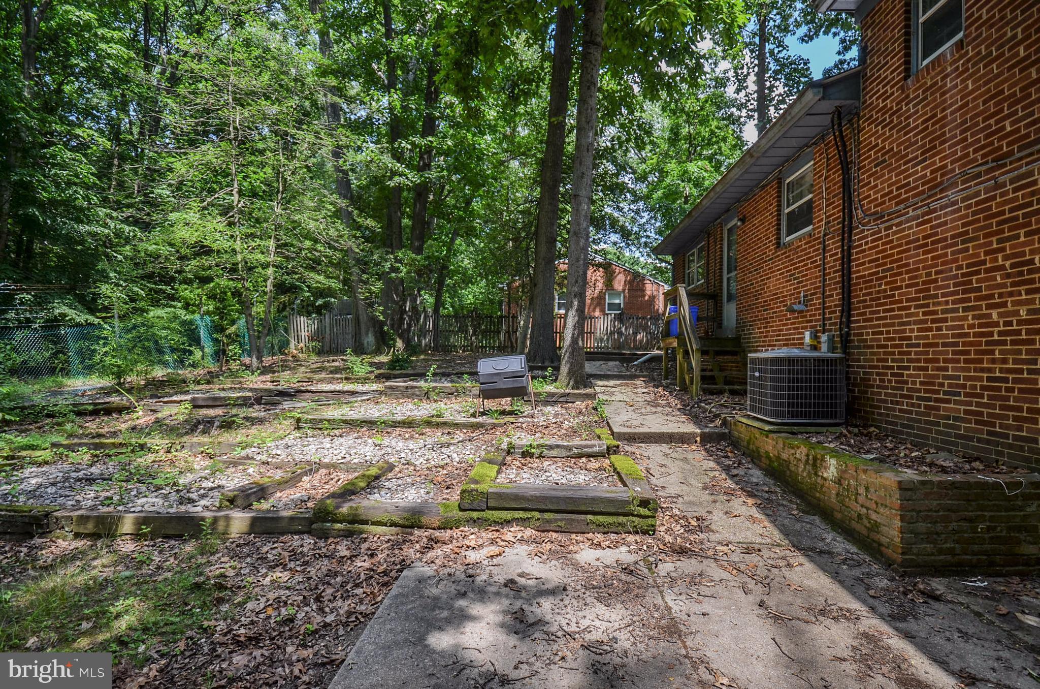 10751 Kinloch Road Silver Spring, MD 20903 - Photo 28 of 30 a backyard of a house with lots of green space