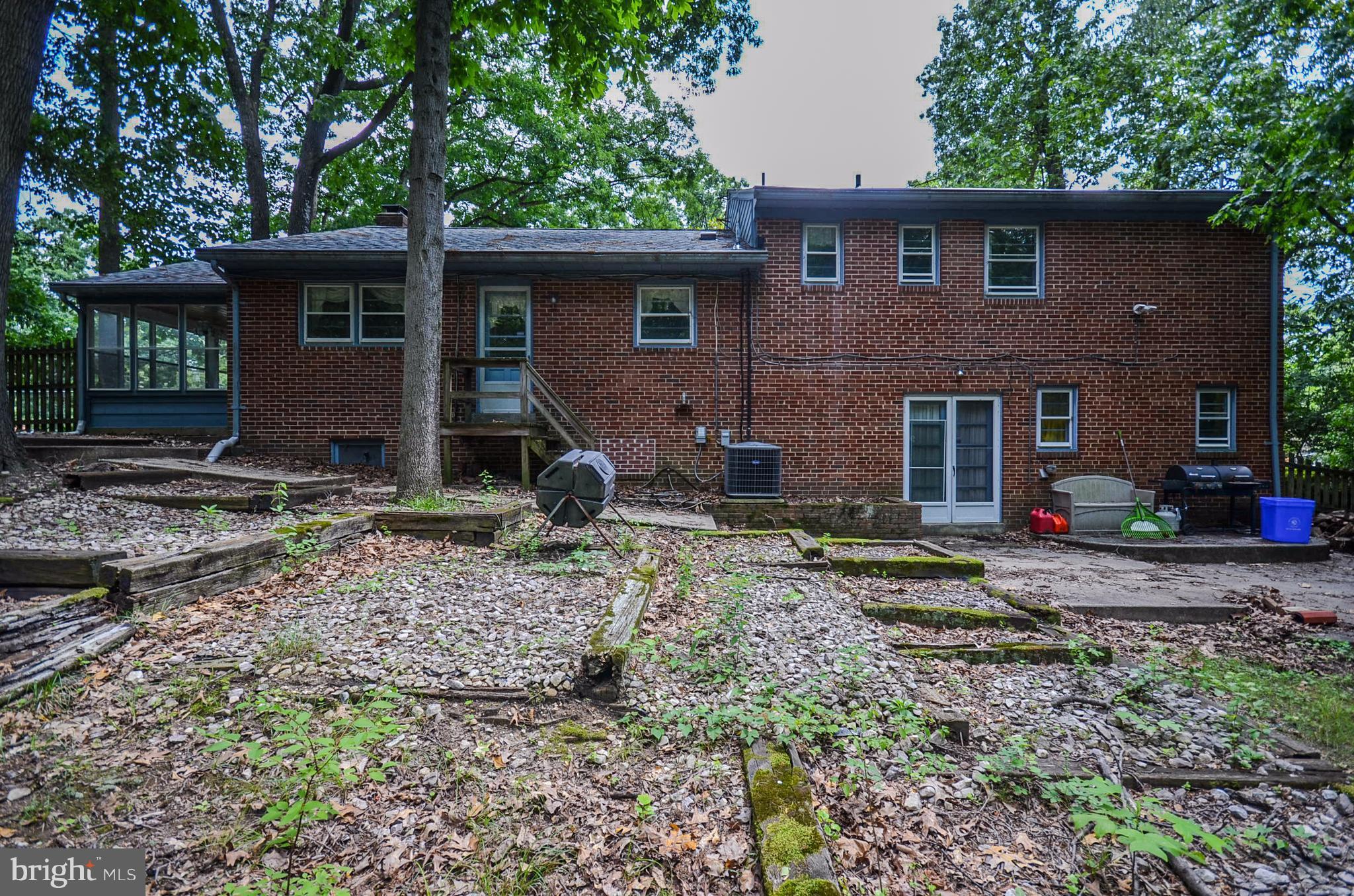 10751 Kinloch Road Silver Spring, MD 20903 - Photo 29 of 30 a front view of a house with garden
