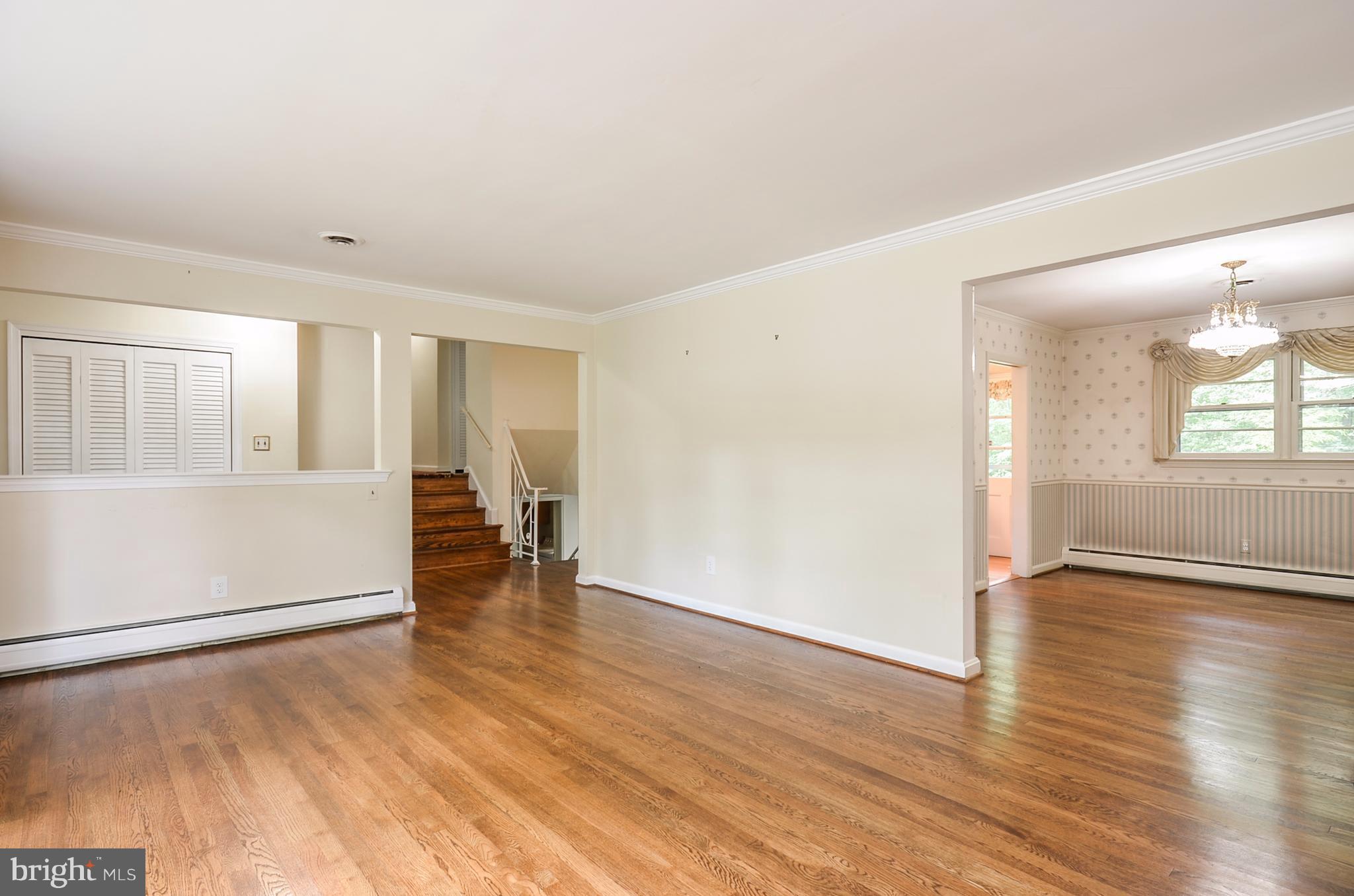 10751 Kinloch Road Silver Spring, MD 20903 - Photo 4 of 30 wooden floor in an empty room with a window