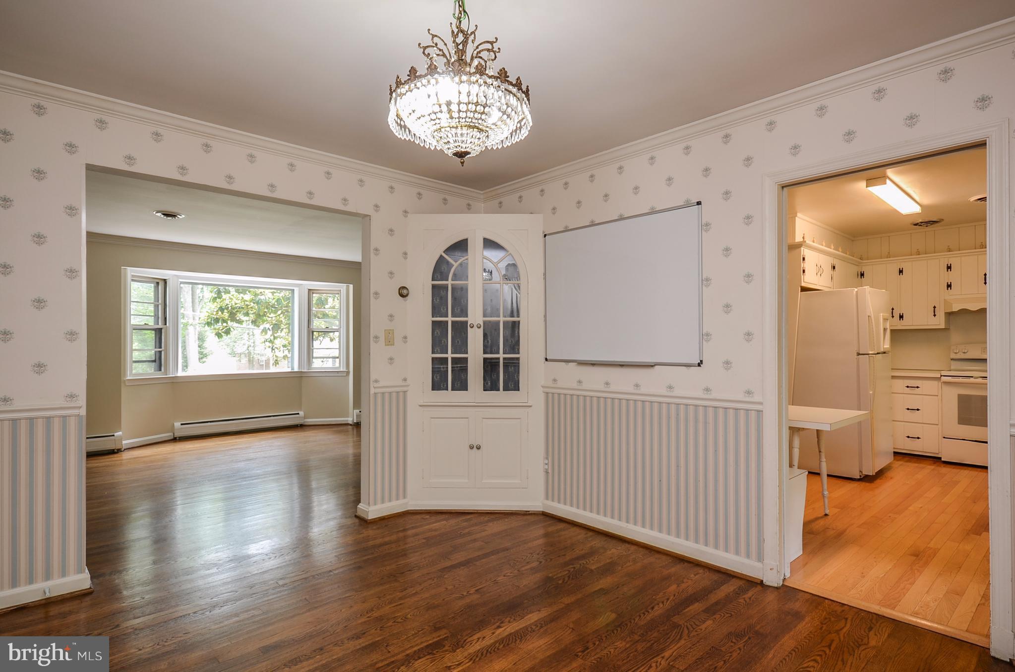 10751 Kinloch Road Silver Spring, MD 20903 - Photo 5 of 30 a view of a livingroom with furniture wooden floor and windows