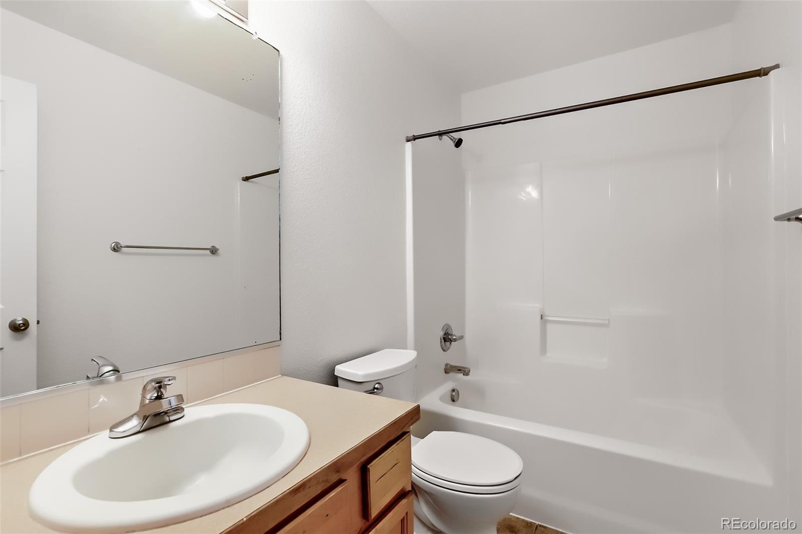 3708 Salida Court Evans, CO 80620 - Photo 16 of 19 a bathroom with a sink toilet and shower