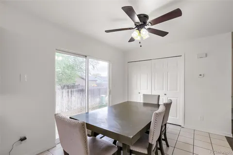 a view of a dining room with furniture and a window
