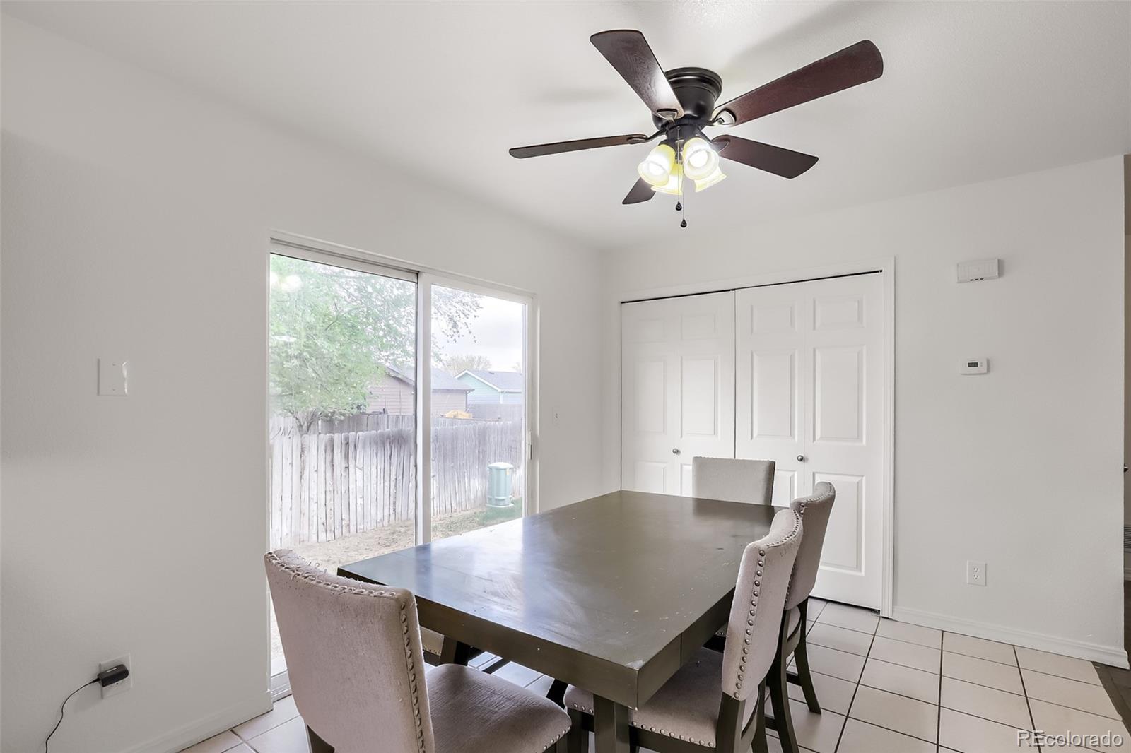 3708 Salida Court Evans, CO 80620 - Photo 8 of 19 a view of a dining room with furniture and a window