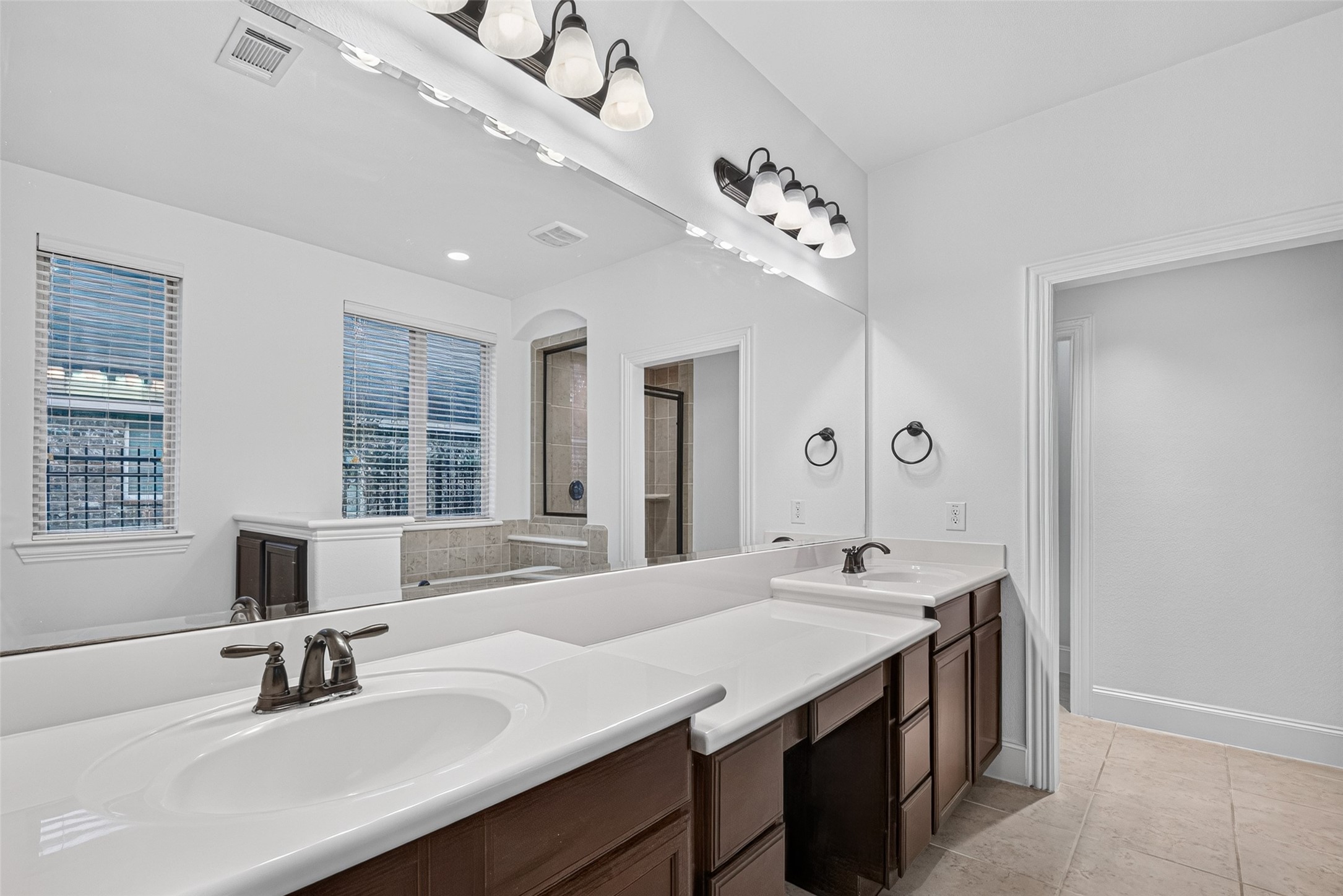 7930 Summer Night Lane Rosenberg, TX 77469 - Photo 22 of 48 Spacious primary bath featuring dual vanities, ample counter space, and a large mirror.