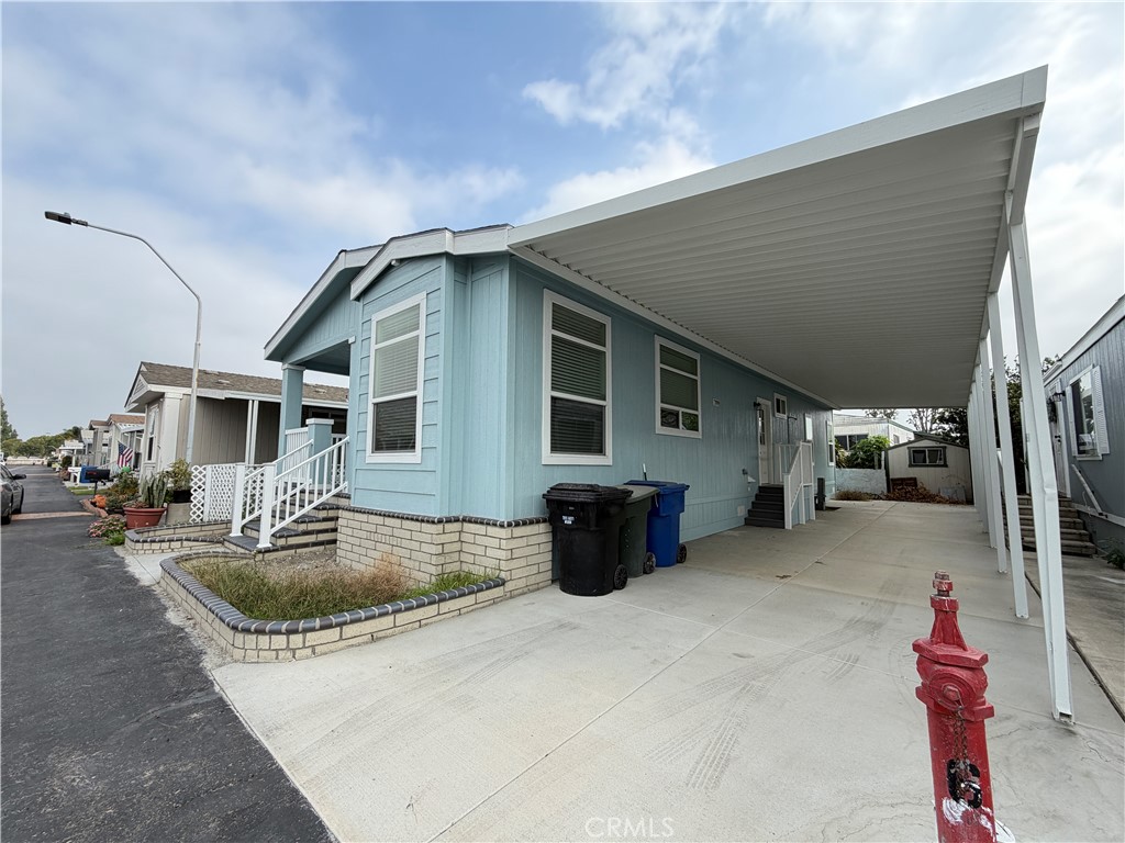 9080 Bloomfield Street, Unit 231 Cypress, CA 90630 - Photo 2 of 20 a front view of a house with garage