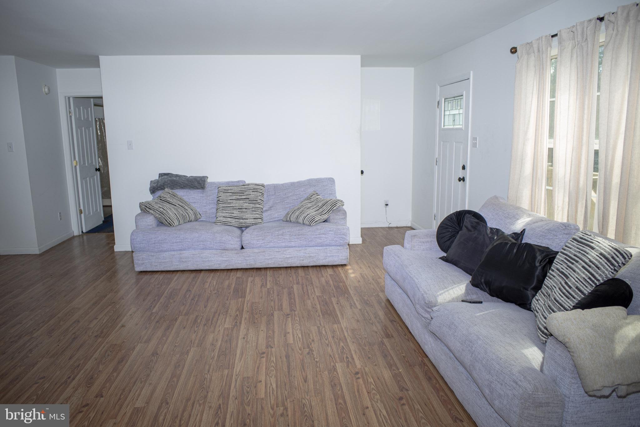 250 Shoemaker Lane Bridgeton, NJ 08302 - Photo 21 of 33 a living room with furniture and a wooden floor