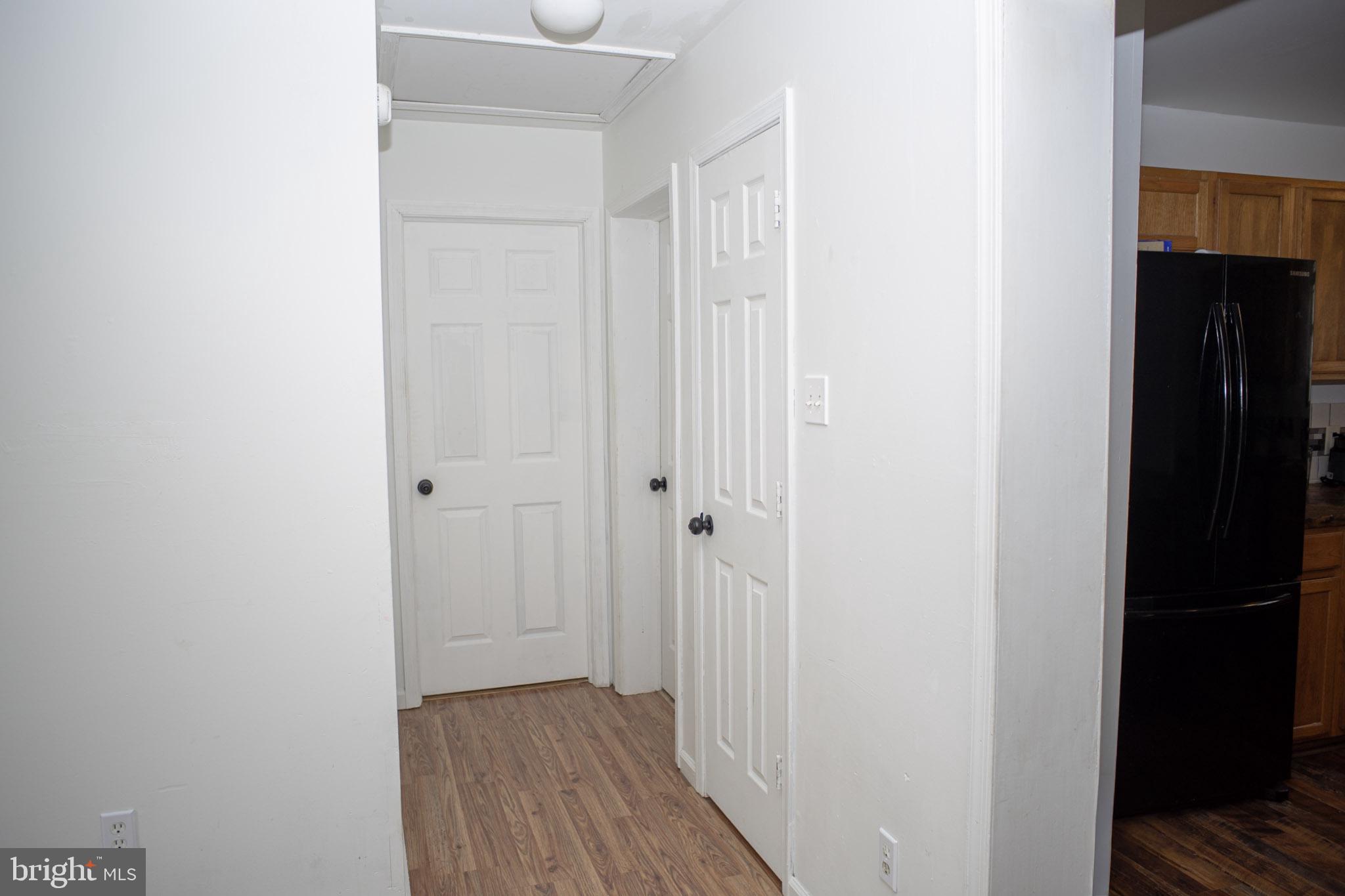 250 Shoemaker Lane Bridgeton, NJ 08302 - Photo 27 of 33 a view of a hallway with wooden floor