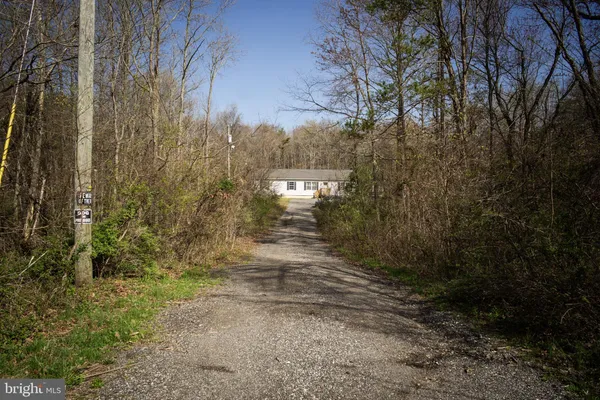 a kitchen with stainless steel appliances granite countertop a stove a refrigerator and a sink