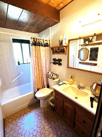 1456 Navajo Road Coalville, UT 84017 - Photo 17 of 55 Full bathroom with a wood ceiling with exposed beams, vanity, and shower / bath combo