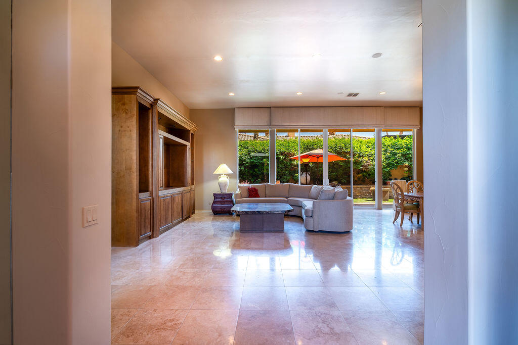79160 Jack Rabbit Trail La Quinta, CA 92253 - Photo 14 of 48 a living room with furniture and a large window