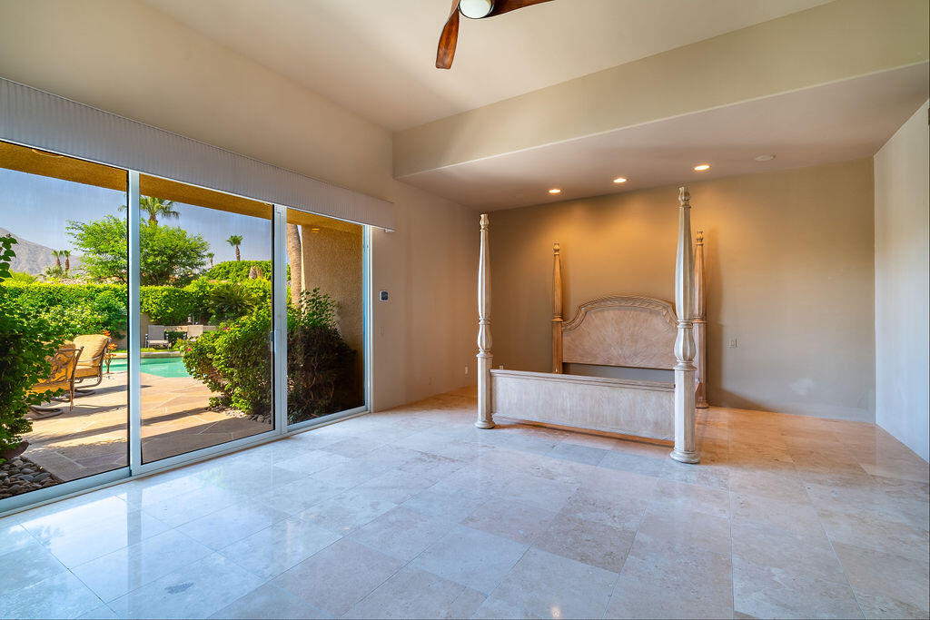 79160 Jack Rabbit Trail La Quinta, CA 92253 - Photo 22 of 48 a view of an empty room with a sliding door