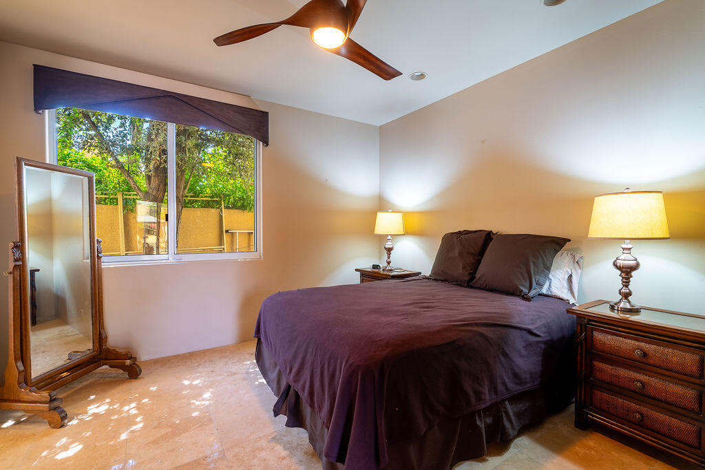 79160 Jack Rabbit Trail La Quinta, CA 92253 - Photo 29 of 48 a bedroom with a bed and a lamp