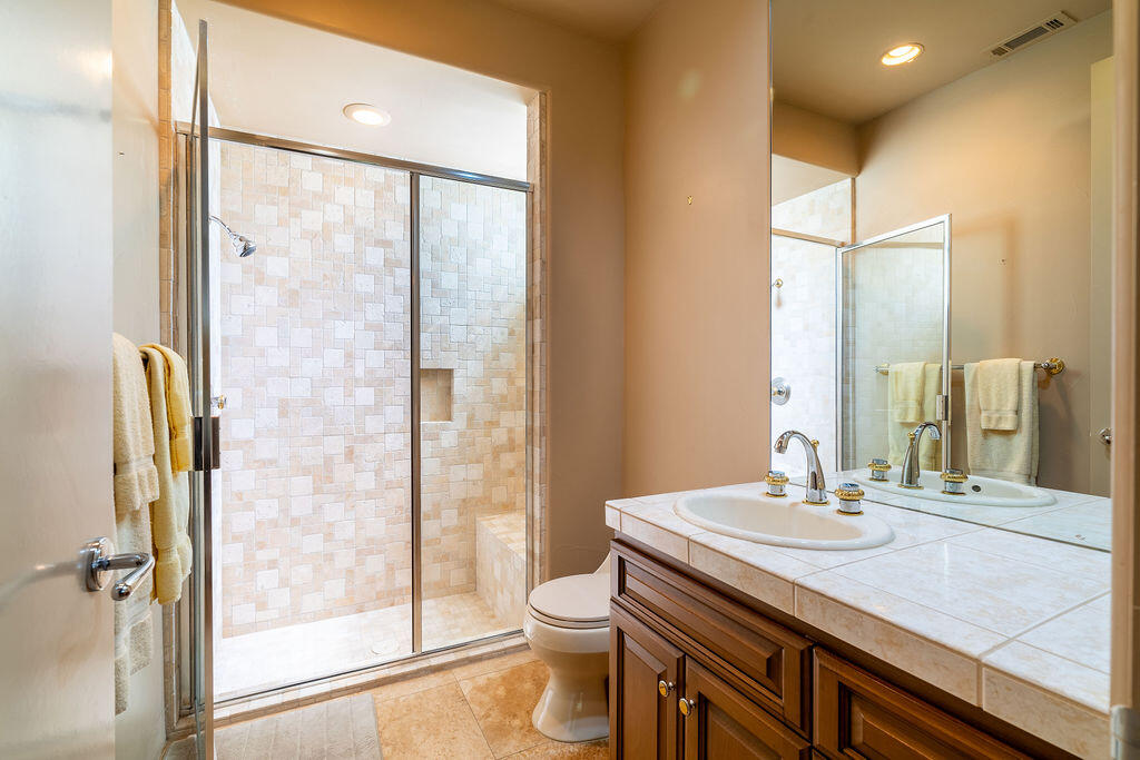 79160 Jack Rabbit Trail La Quinta, CA 92253 - Photo 30 of 48 a bathroom with a granite countertop sink toilet and shower