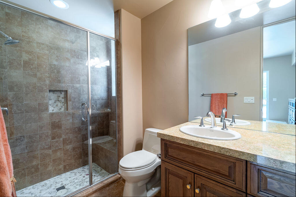 79160 Jack Rabbit Trail La Quinta, CA 92253 - Photo 42 of 48 a bathroom with a sink toilet and shower