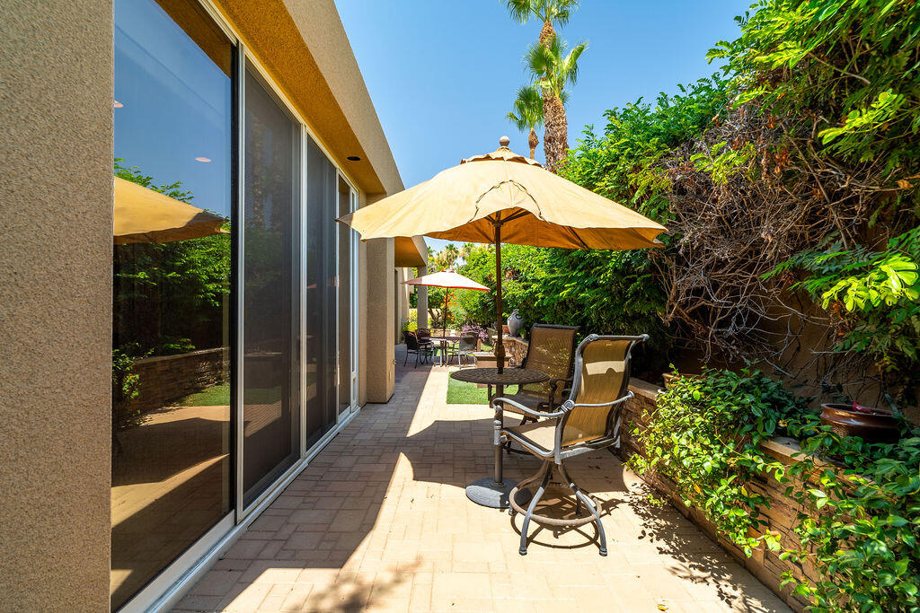 79160 Jack Rabbit Trail La Quinta, CA 92253 - Photo 46 of 48 a view of a patio with a table and chairs under an umbrella