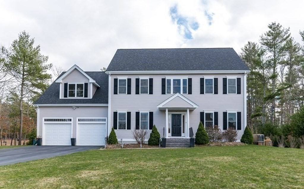 4 Douglas Corner Rochester, MA 02770 - Photo 1 of 42 a front view of a house with a yard