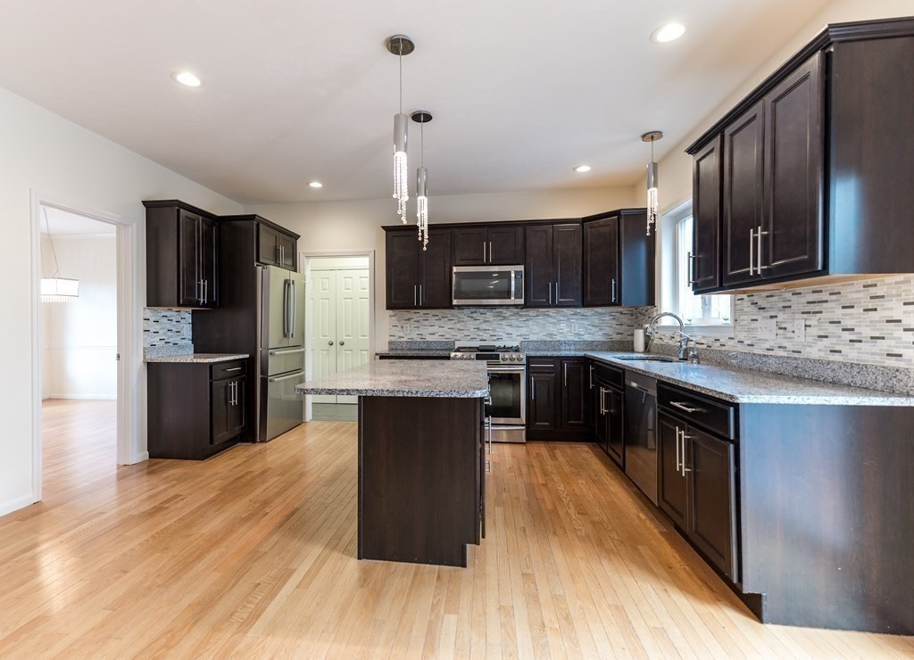 4 Douglas Corner Rochester, MA 02770 - Photo 2 of 42 a kitchen with stainless steel appliances kitchen island granite countertop a stove a sink a refrigerator and a microwave