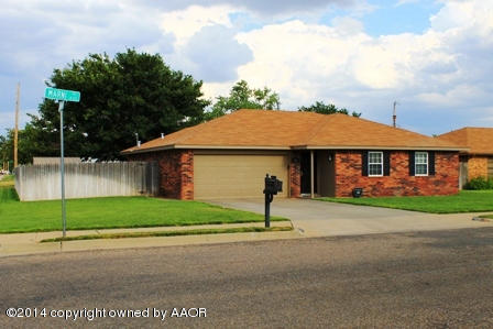 8101 Marni Trail Amarillo, TX 79110 - Photo 2 of 39 a front view of a house with a yard and garage