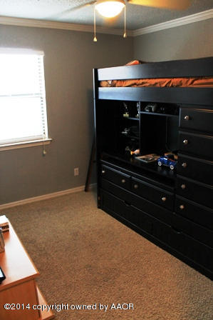 8101 Marni Trail Amarillo, TX 79110 - Photo 16 of 39 a room with furniture and flat screen tv