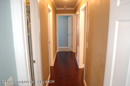 8101 Marni Trail Amarillo, TX 79110 - Photo 19 of 39 a view of a hallway with wooden floor
