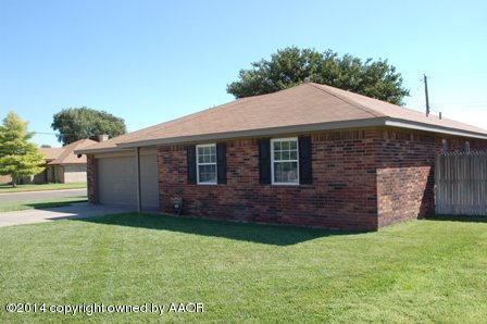 8101 Marni Trail Amarillo, TX 79110 - Photo 3 of 39 a front view of a house with a garden