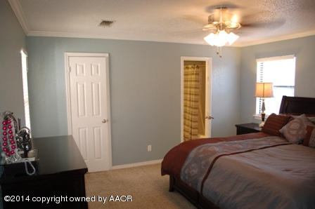8101 Marni Trail Amarillo, TX 79110 - Photo 22 of 39 a bedroom with a bed and a window