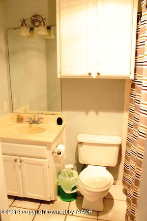 8101 Marni Trail Amarillo, TX 79110 - Photo 24 of 39 a bathroom with a toilet and a sink
