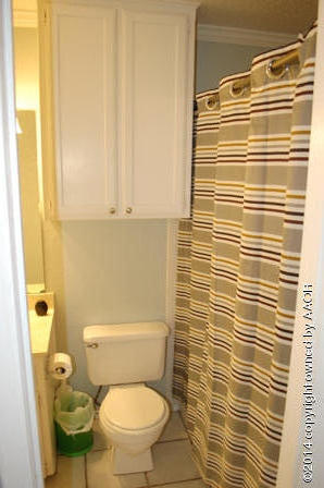 8101 Marni Trail Amarillo, TX 79110 - Photo 25 of 39 a bathroom with a toilet and a shower curtain