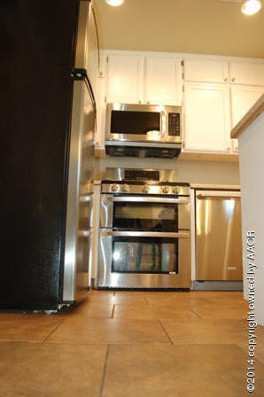 8101 Marni Trail Amarillo, TX 79110 - Photo 30 of 39 a kitchen with a stove and a microwave
