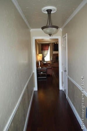 8101 Marni Trail Amarillo, TX 79110 - Photo 5 of 39 a view of a hallway view with hardwood floor and living room