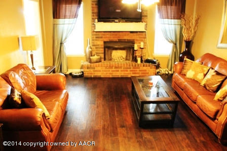 8101 Marni Trail Amarillo, TX 79110 - Photo 6 of 39 a living room with furniture and a fireplace