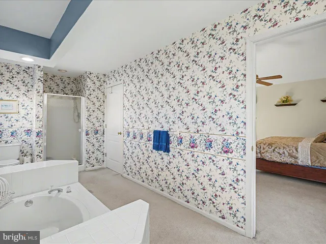 a bathroom with a bathtub and sink