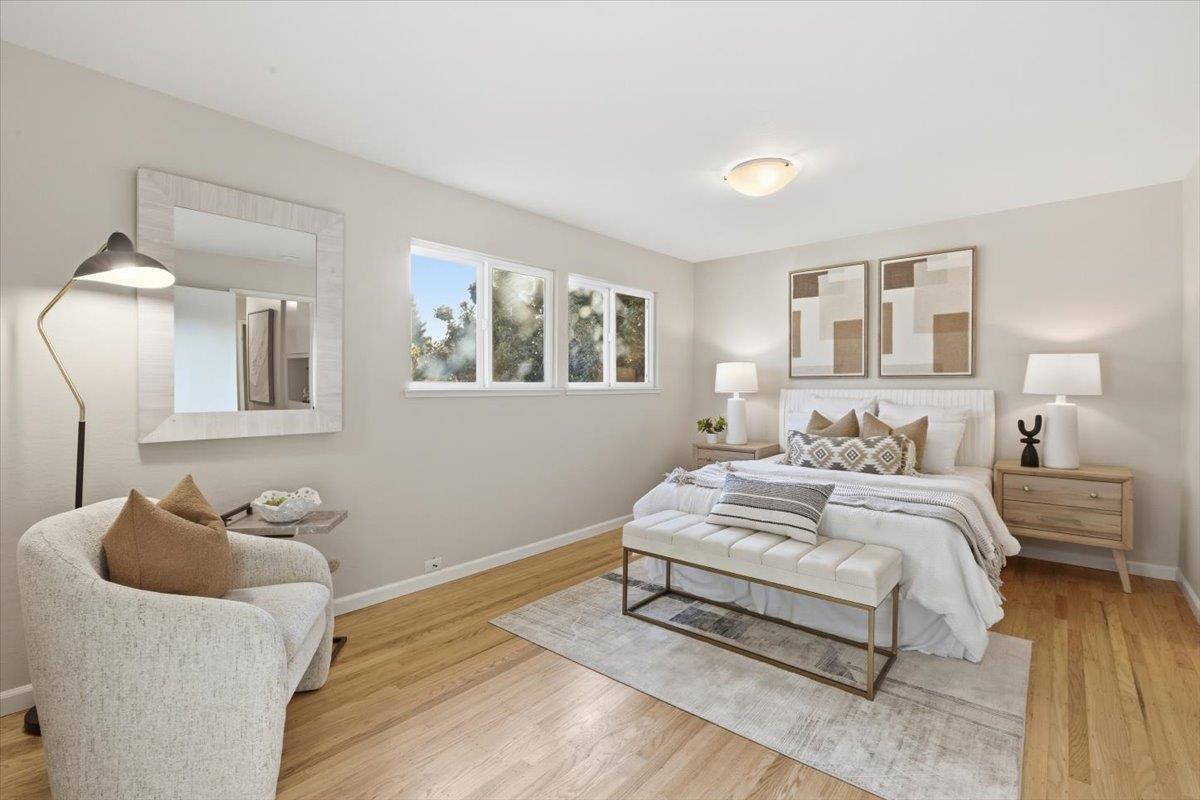 1542 Canna Court Mountain View, CA 94043 - Photo 14 of 34 a bedroom with a bed and wooden floor