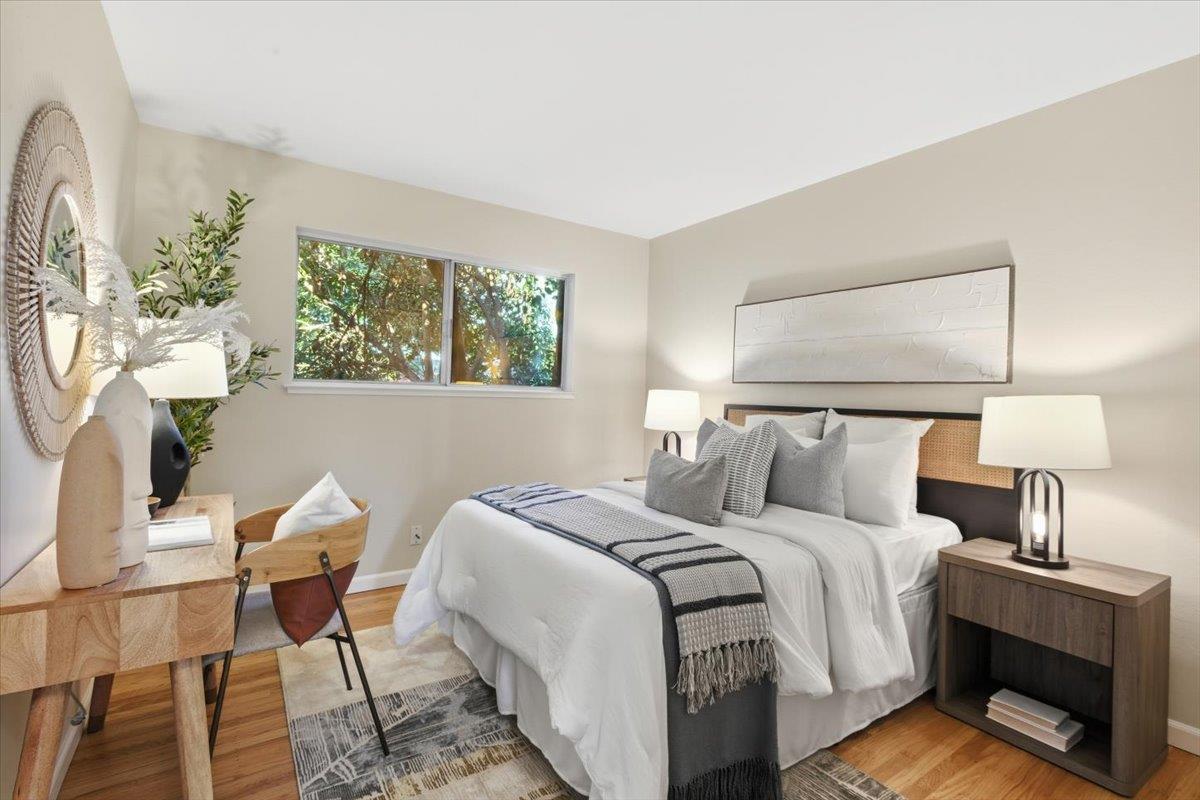1542 Canna Court Mountain View, CA 94043 - Photo 20 of 34 a bedroom with a bed and a lamp
