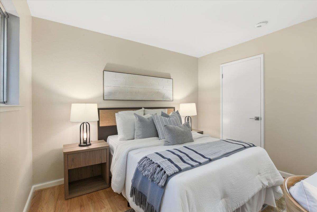1542 Canna Court Mountain View, CA 94043 - Photo 21 of 34 a bedroom with a bed and wooden floor