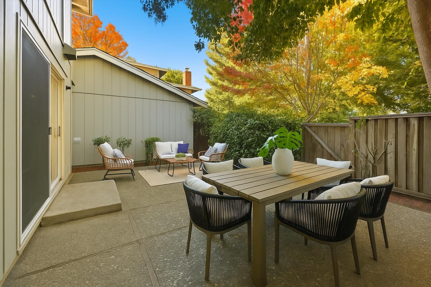 1542 Canna Court Mountain View, CA 94043 - Photo 24 of 34 a view of a patio with table and chairs with wooden fence
