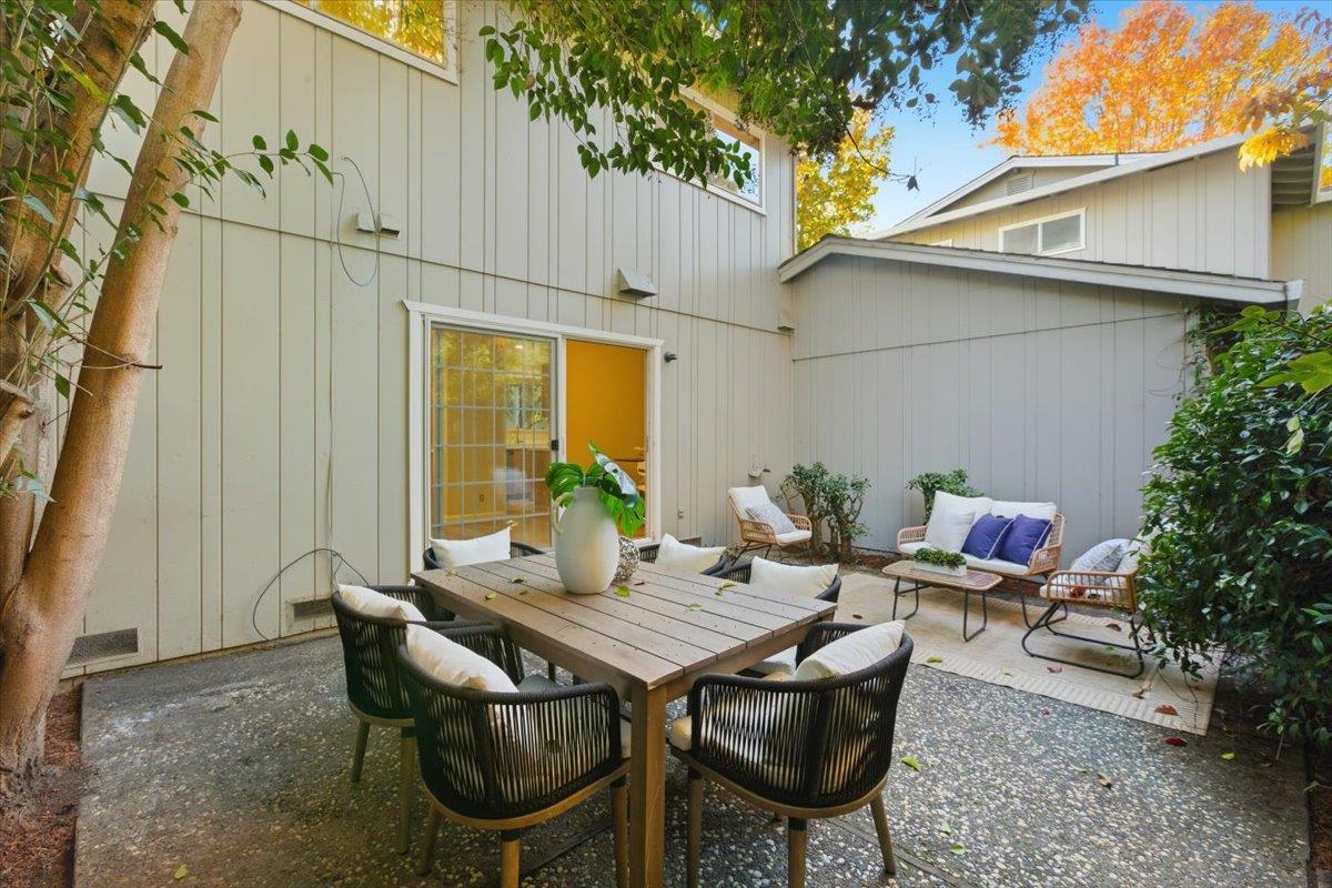 1542 Canna Court Mountain View, CA 94043 - Photo 25 of 34 a backyard of a house with table and chairs