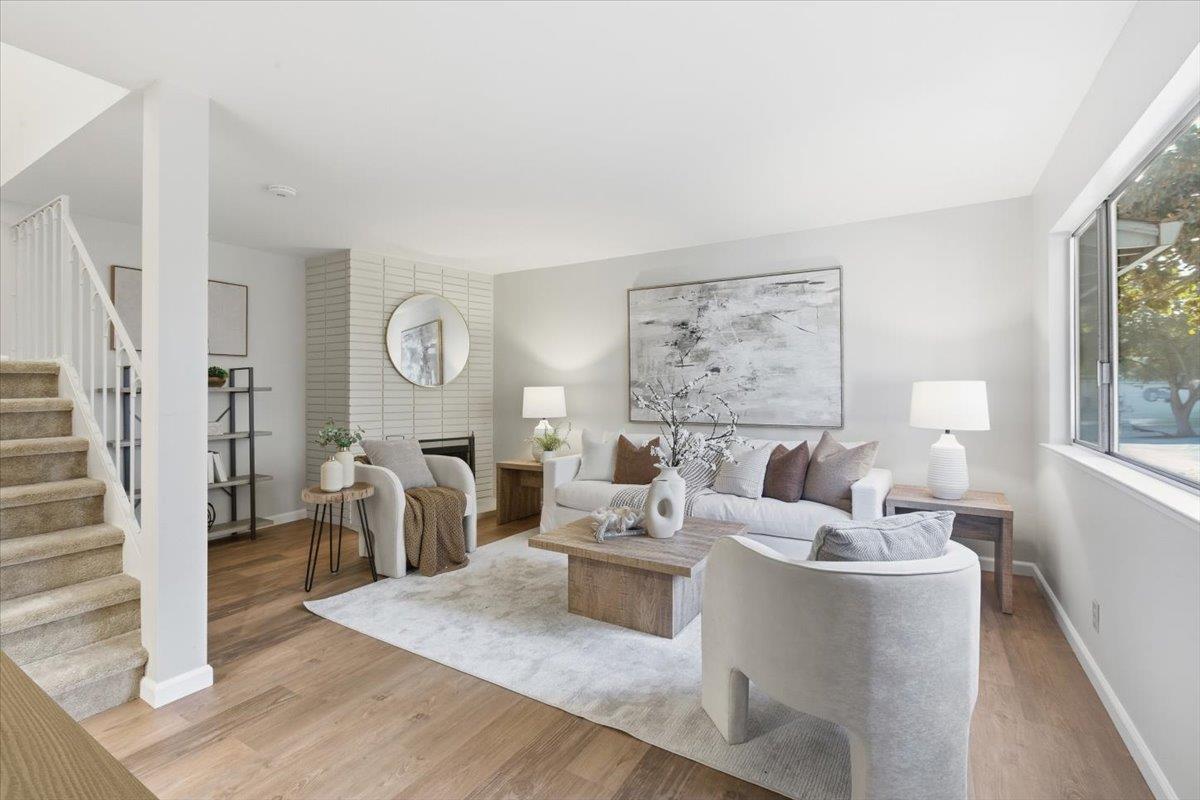 1542 Canna Court Mountain View, CA 94043 - Photo 3 of 34 a living room with furniture large window and wooden floor