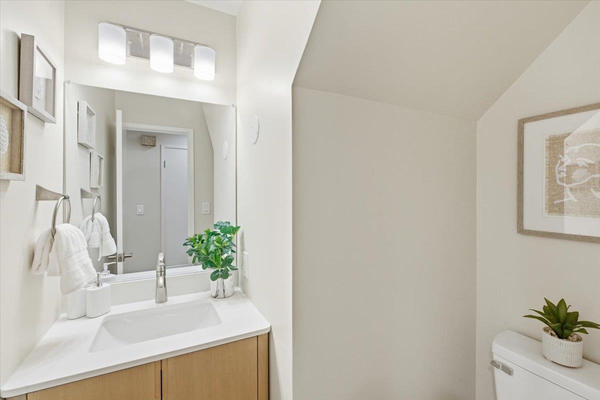 1542 Canna Court Mountain View, CA 94043 - Photo 6 of 34 a bathroom with a sink a vanity and a mirror