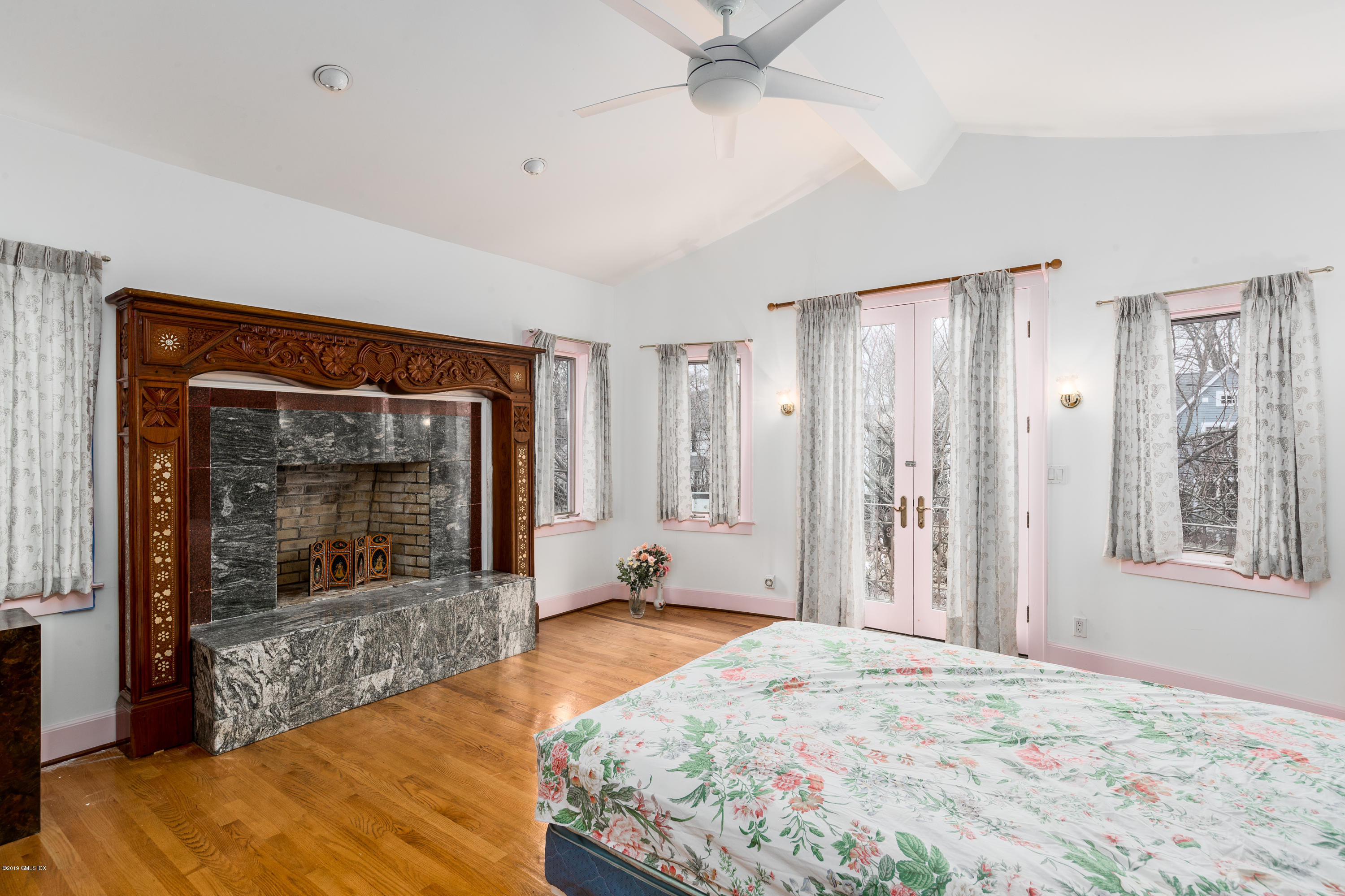 25 Oval Avenue Riverside, CT 06878 - Photo 12 of 18 a bedroom with a bed and a fireplace