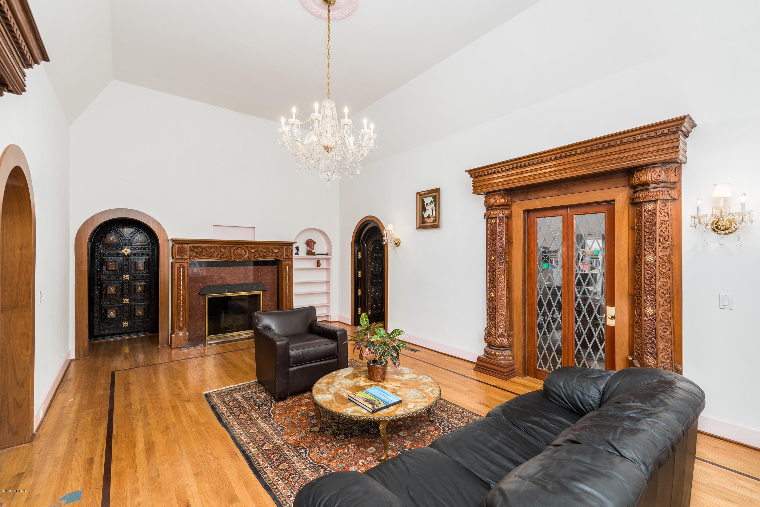 25 Oval Avenue Riverside, CT 06878 - Photo 3 of 18 a living room with furniture and a fireplace