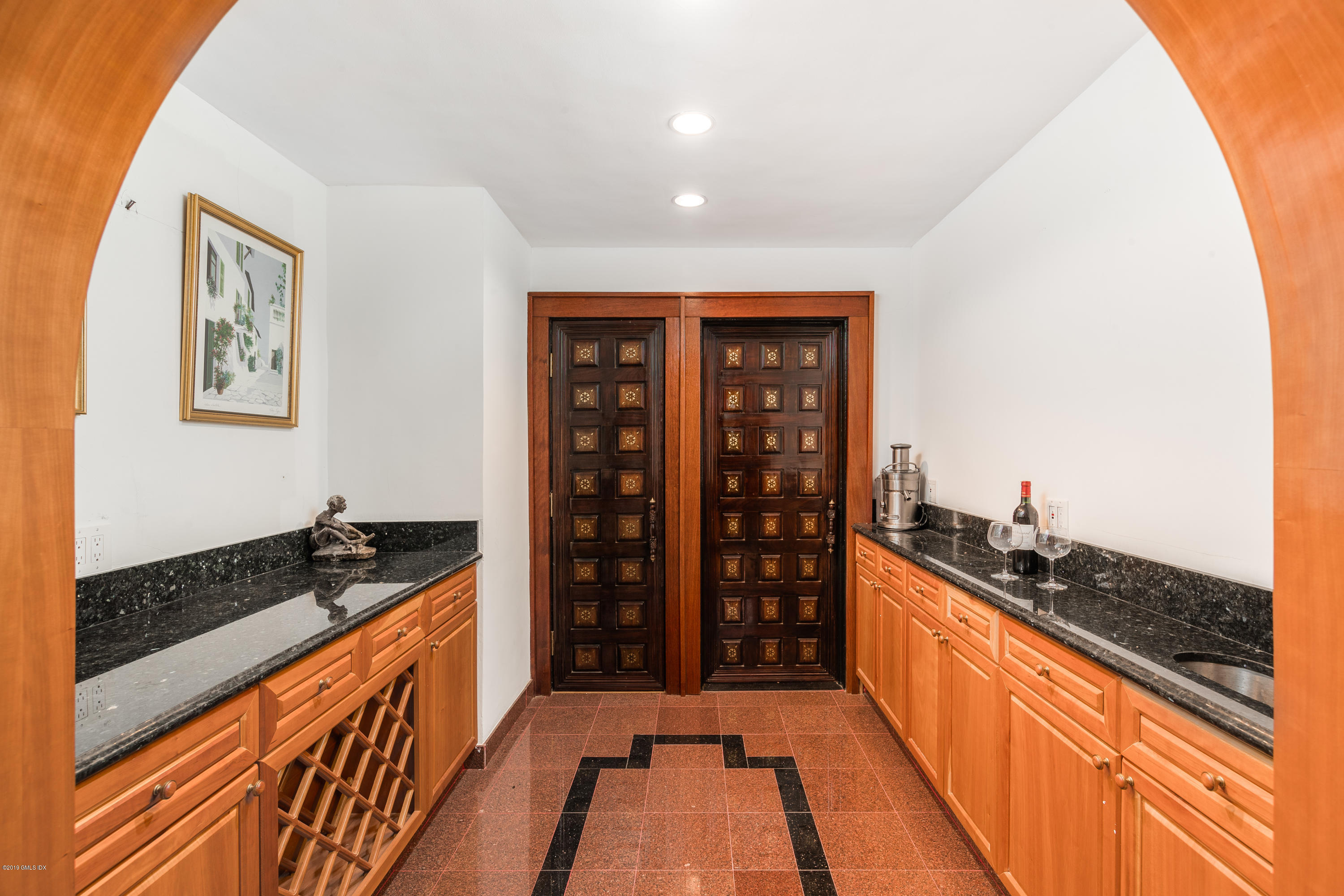 25 Oval Avenue Riverside, CT 06878 - Photo 8 of 18 a kitchen with stainless steel appliances granite countertop a stove and a sink