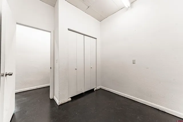 a bathroom with a sink a faucet and a potted plant